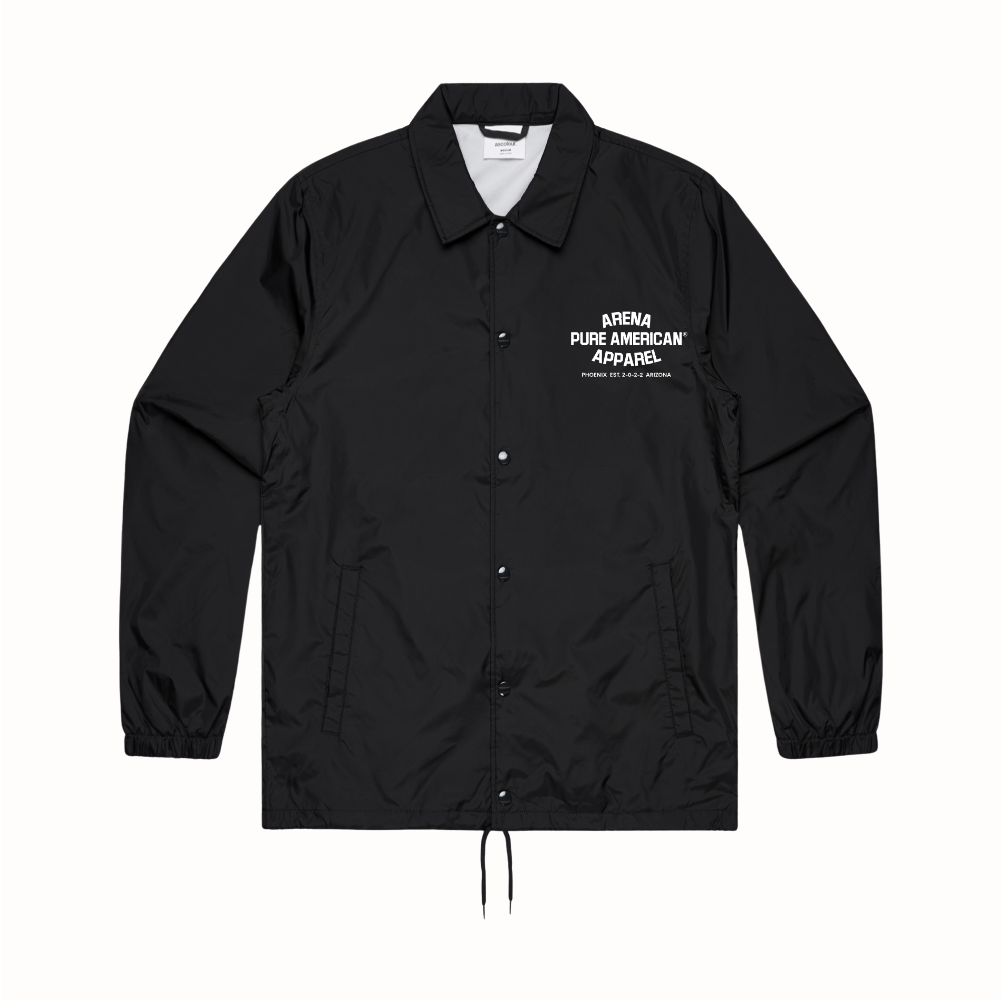 A black coach-style jacket with a white embroidered logo on the left chest reading 'ARENA FLUE AMERICAN APPAREL' and 'COSTUME DE PLUMIER', shown flat against a white background.