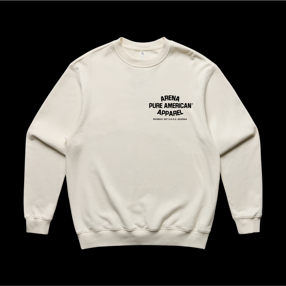 An off-white crewneck sweatshirt with black text on the chest reading 'ARENA PURE AMERICAN APPAREL' and 'WATERFALL, OR 48 N. 2nd St.