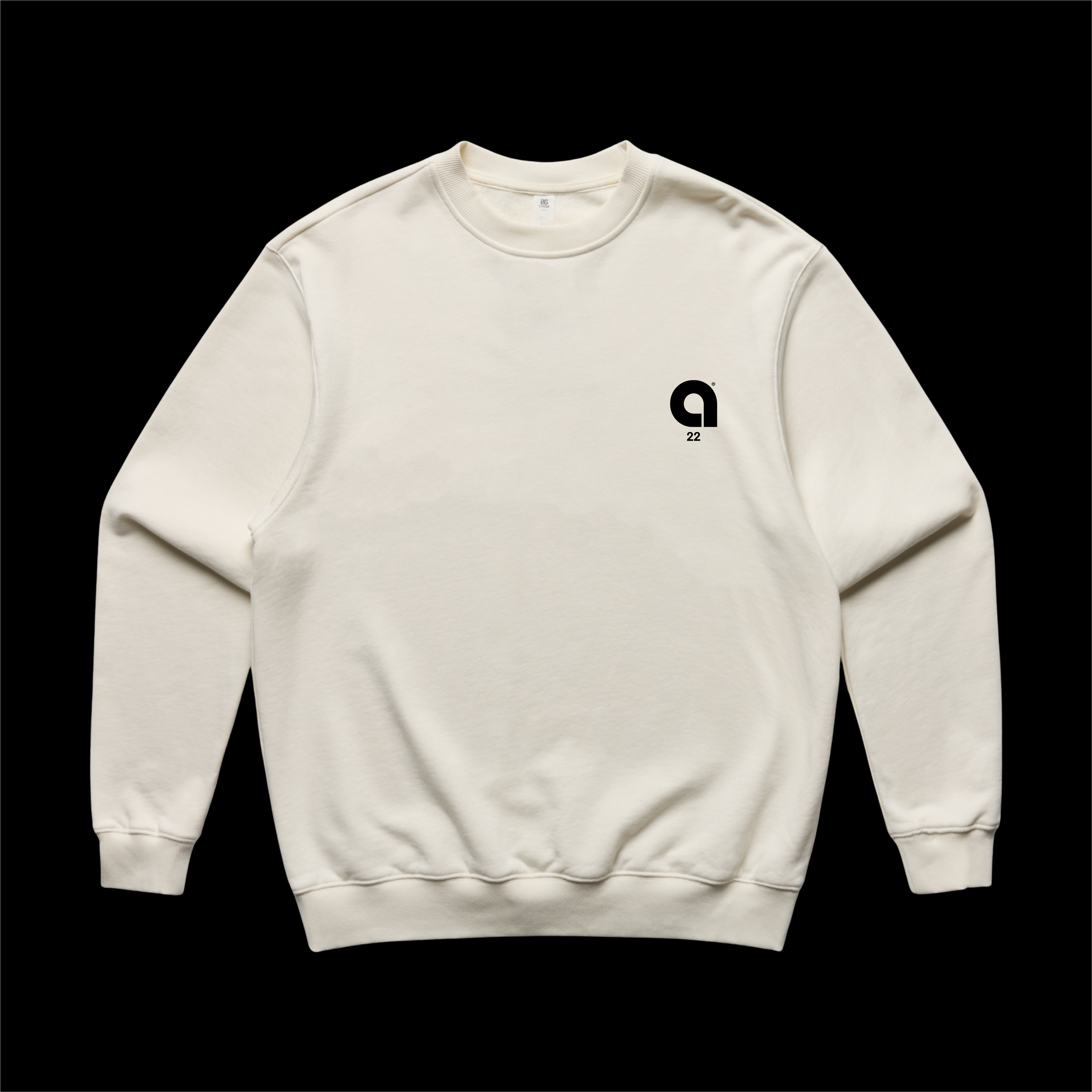An off-white crewneck sweatshirt with a small black graphic logo on the left chest, displayed flat against a solid black background.