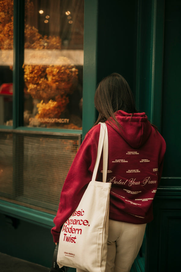 Lifestyle view of decorated hoodie and canvas tote