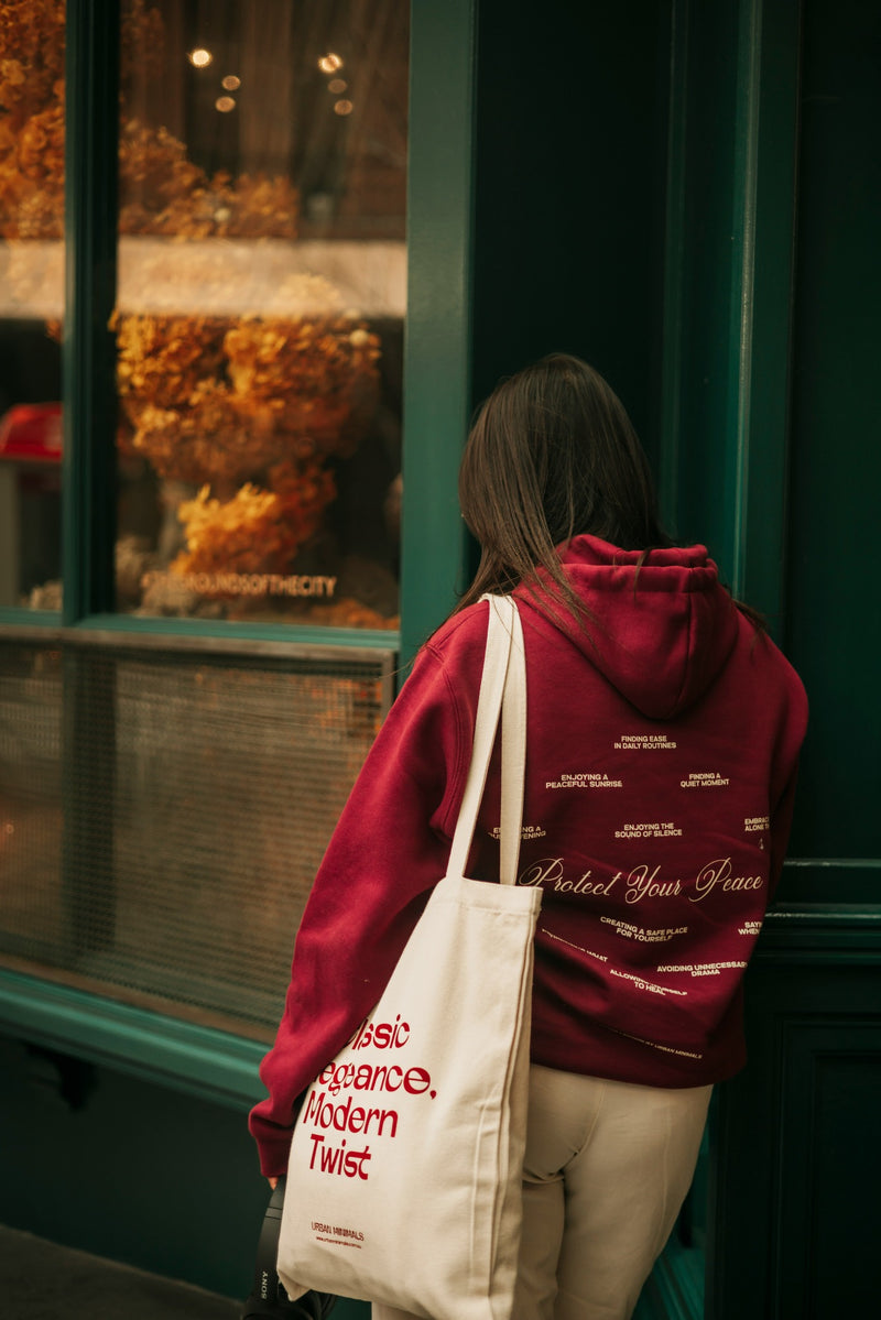 Lifestyle view of decorated hoodie and canvas tote